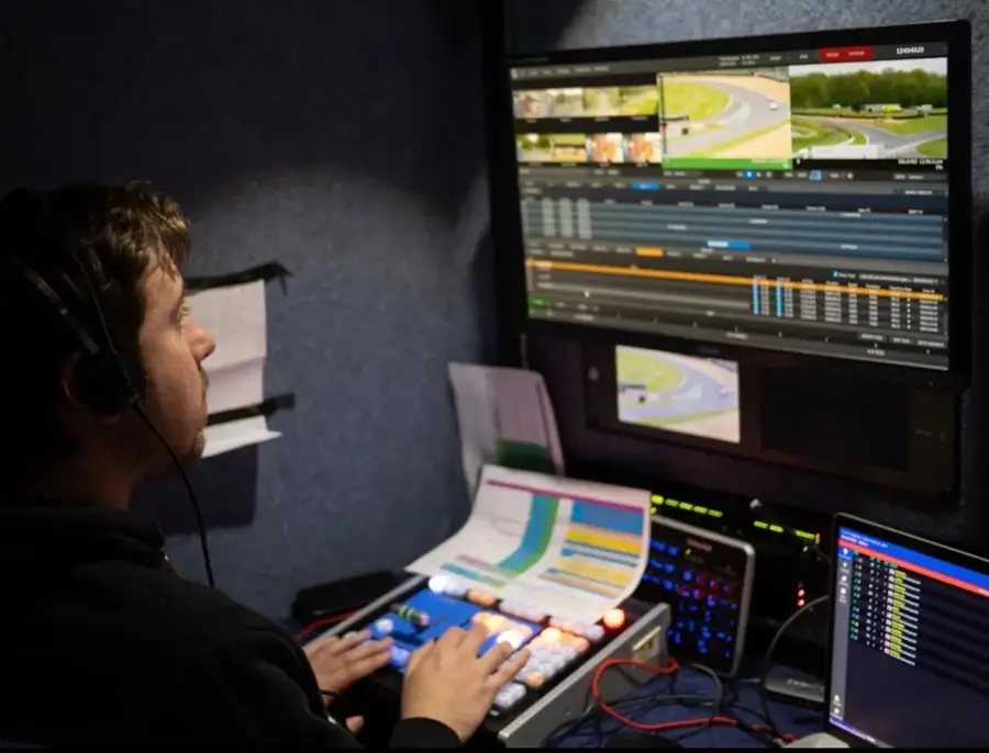 James Watson operating a broadcast camera on a sports production