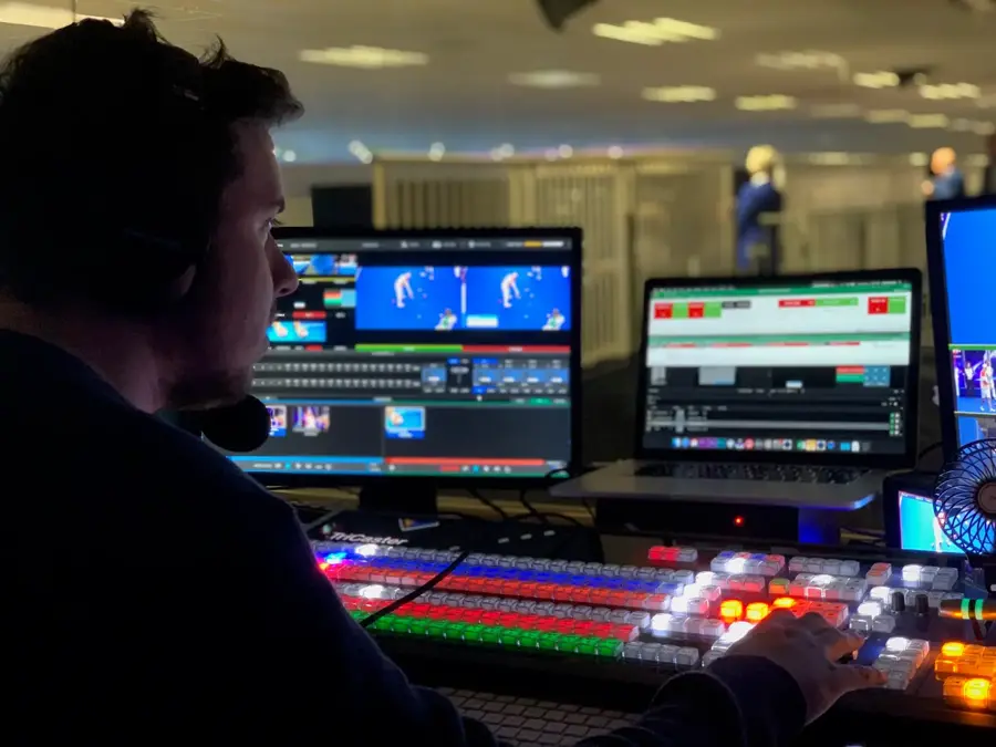 James Watson at a vision mixer as technical director
